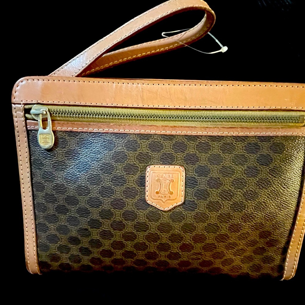 Elegant and timeless vintage Celine clutch in great condition, wristlet strap.